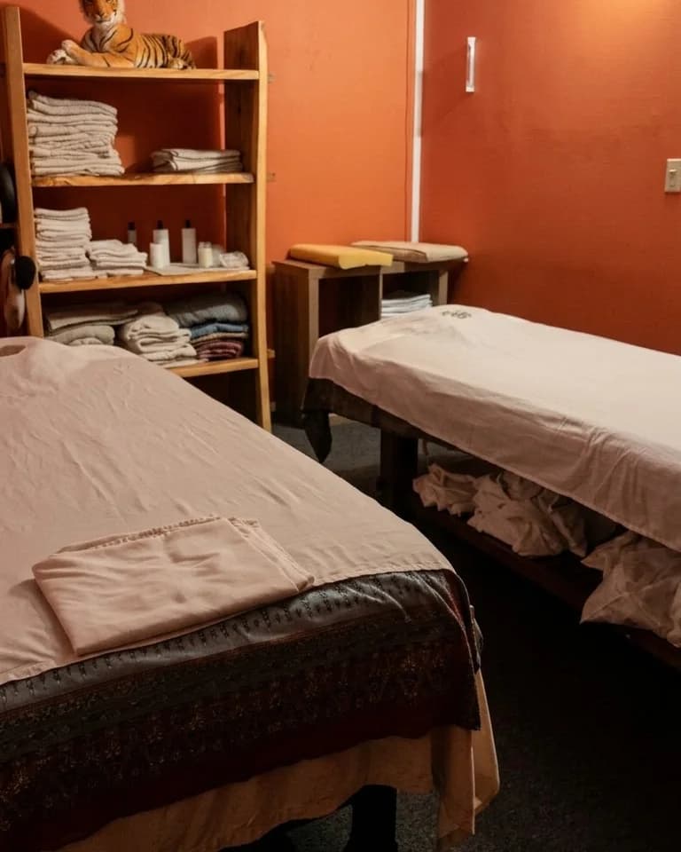Couples massage room with two tables side by side